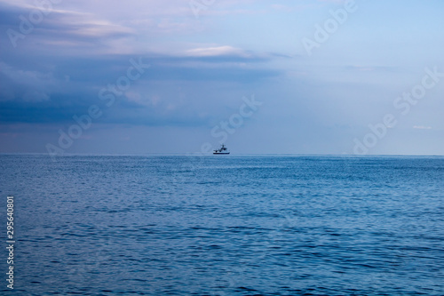 Calm morning Black Sea and boat on the horizon