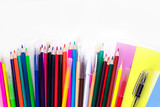 A lot of multi-colored school and office supplies on a white background. Back to school. Copyspace for text