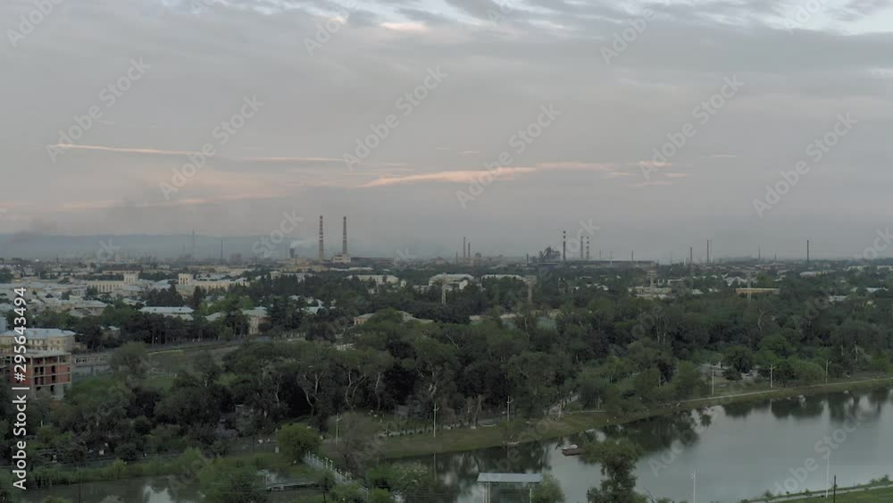 Factory Pipes in Georgia City drone slowmotion Residential buildings in Rustavi. Old soviet block of flats concrete building living houses Factory Pipes in Georgia City drone slowmotion Residential buildings in Rustavi. Old soviet block of flats concrete building living houses