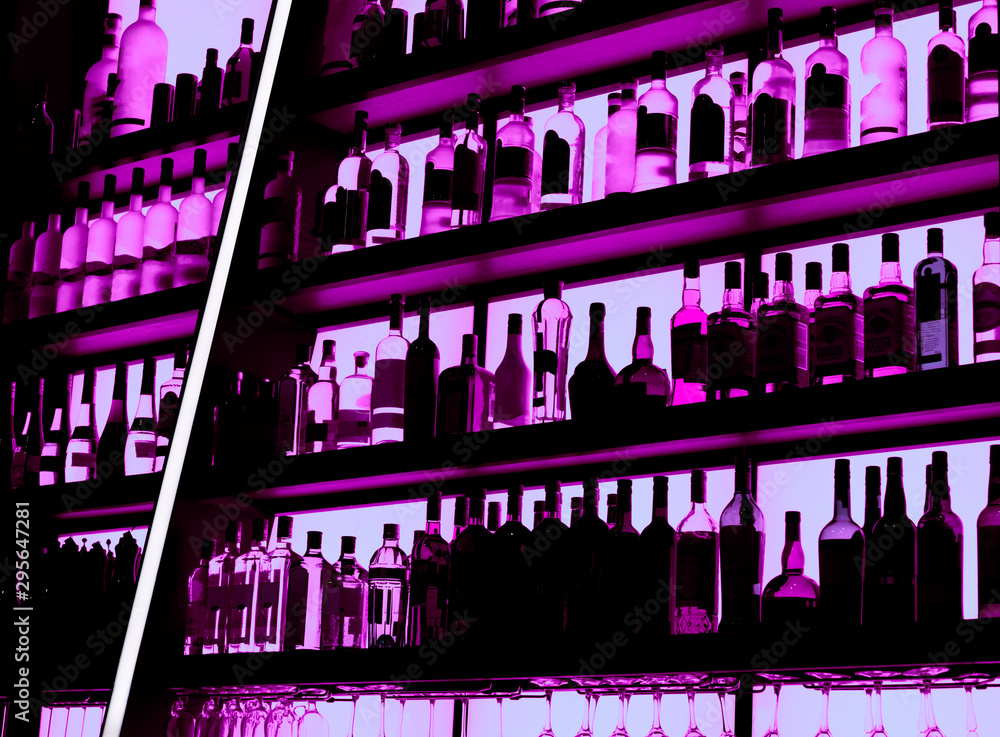 Rows of bottles sitting on shelf in a bar, trademarks deleted Rows of bottles sitting on shelf in a bar, trademarks deleted