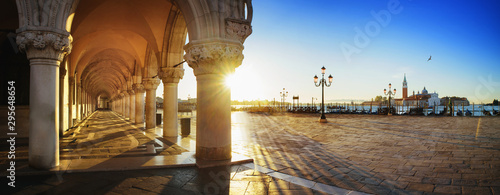  San Marco with the curch San Giorgio di Maggiore in the background in Venice, Italy at a dramatic sunrise
