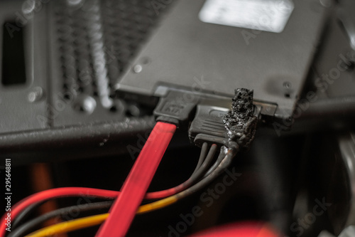 A charred, suffered a power surge burnt hard drive. suffered a power surge. black with soot. short circuit