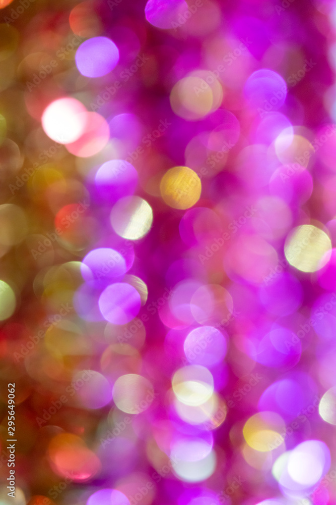 Obraz premium Pink christmas tree lights. Defocus. Background for design.