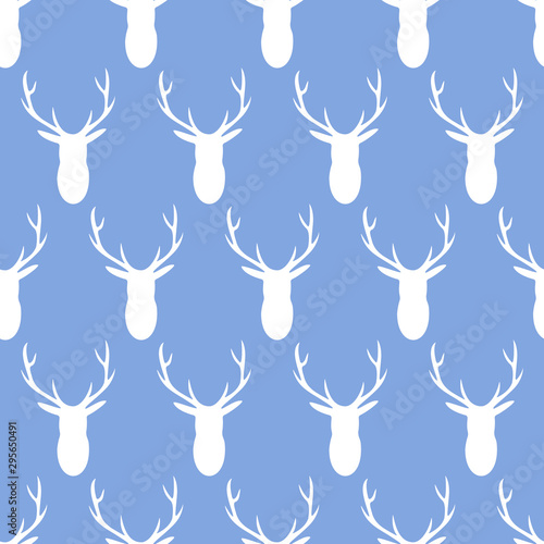 Vector seamless pattern of white deer heads with antlers on a blue background. Great for nursery decor, children's fabric and wallpaper.