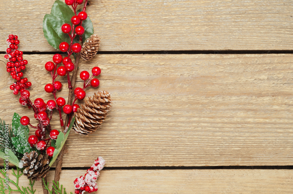 New Year tree balls and hoarfrost berries top view background. Christmas decorations. Fir branches and festive toys. Decorative wooden backdrop with copyspace. Winter holidays composition New Year tree balls and hoarfrost berries top view background. Christmas decorations. Fir branches and festive toys. Decorative wooden backdrop with copyspace. Winter holidays composition