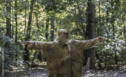 scary man in burlap in the forest