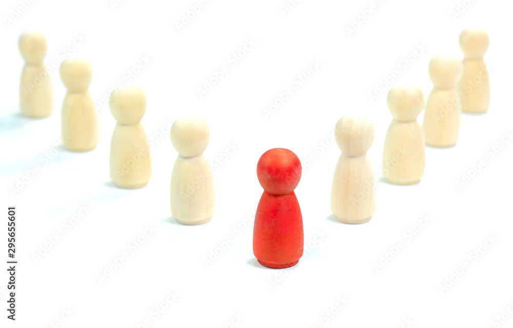 Leadership concept. Red wooden figurine leading the other wooden figurines. Leadership concept. Red wooden figurine leading the other wooden figurines.