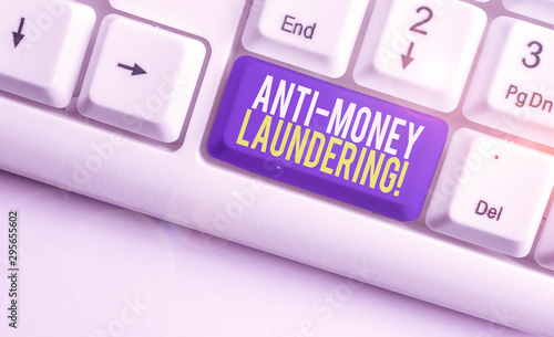 Word writing text Anti Money Laundering. Business photo showcasing regulations stop generating income through illegal actions White pc keyboard with empty note paper above white background key copy photo