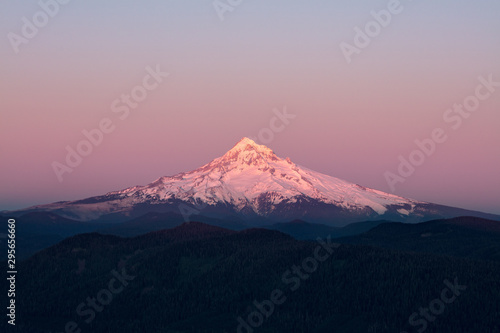 Mount Hood Covered in Snow, active stratovolcano and highest mountain in Oregon. Panoramic View from Sherrard Point, Fire Lookout at the top of Larch Mountain. Sunset, Purple Sky,  Glowing Summit © Cedar