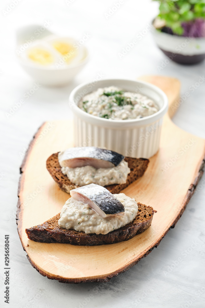 Forshmak - traditional Jewish cuisine. Sandwich with minced herring fillets with apple, onion and egg. Forshmak - traditional Jewish cuisine. Sandwich with minced herring fillets with apple, onion and egg.