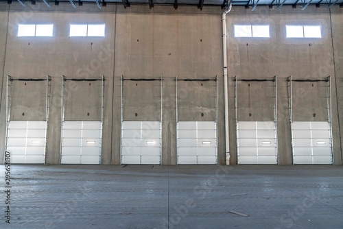 Abandoned warehouse with overhead garage doors in a row