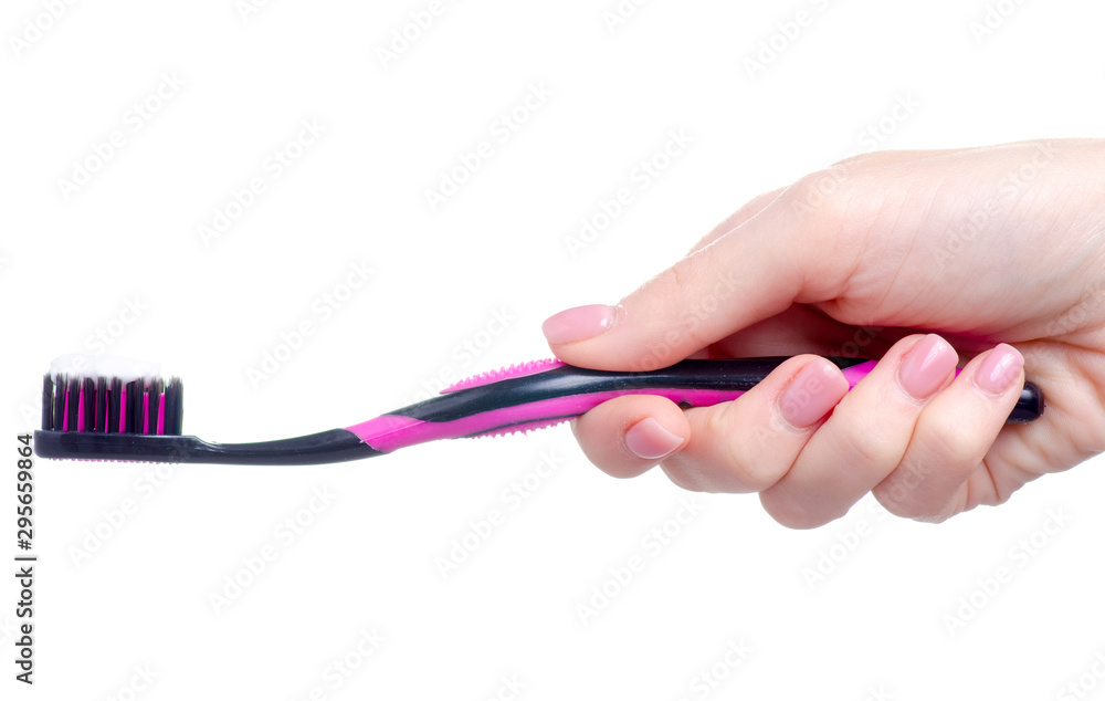 Toothbrush with paste in hand on white background isolation Toothbrush with paste in hand on white background isolation