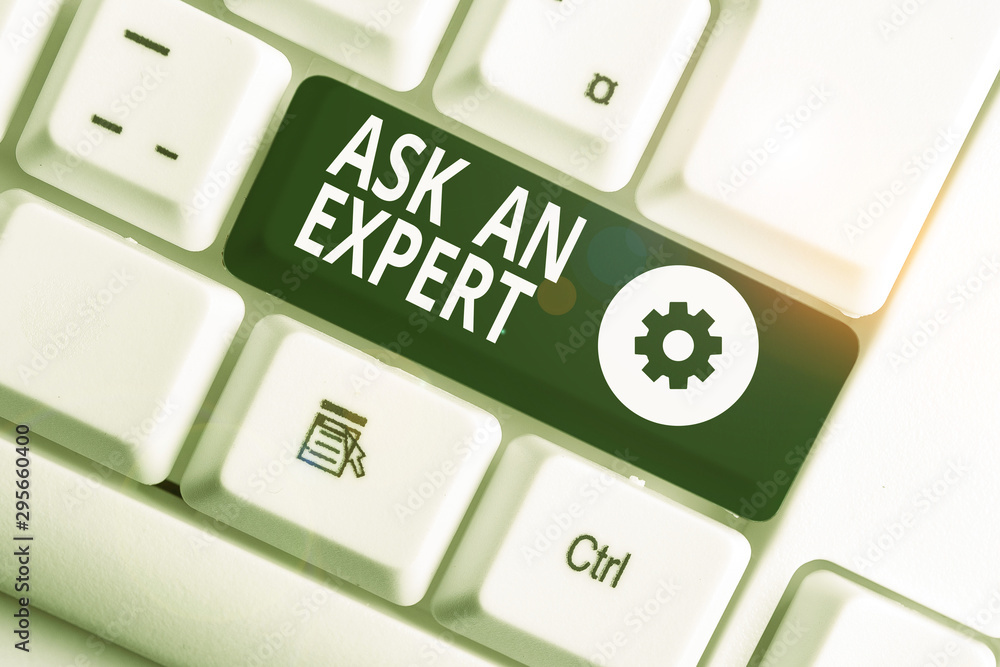 Writing note showing Ask An Expert. Business concept for consult someone who has skill about something or knowledgeable White pc keyboard with note paper above the white background Writing note showing Ask An Expert. Business concept for consult someone who has skill about something or knowledgeable White pc keyboard with note paper above the white background