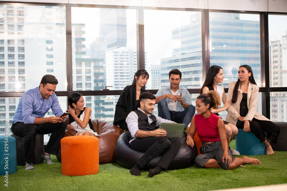 Executives Business people relaxing and talking in nature workplace room, Professional young creative designer talking with team Executives Business people relaxing and talking in nature workplace room, Professional young creative designer talking with team