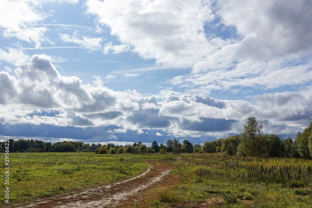 Rain clouds over the field. Autumn landscape. Russia