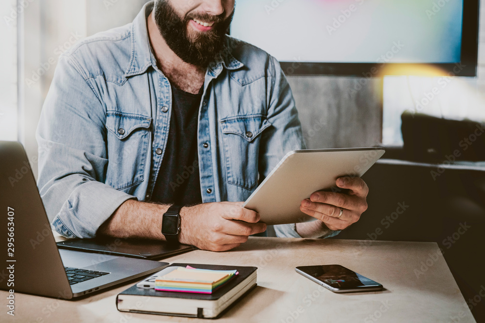 Digital developer testing app on gadgets. Office manager using tablet, laptop and smartphone for work. Businessman checking email. Digital developer testing app on gadgets. Office manager using tablet, laptop and smartphone for work. Businessman checking email.