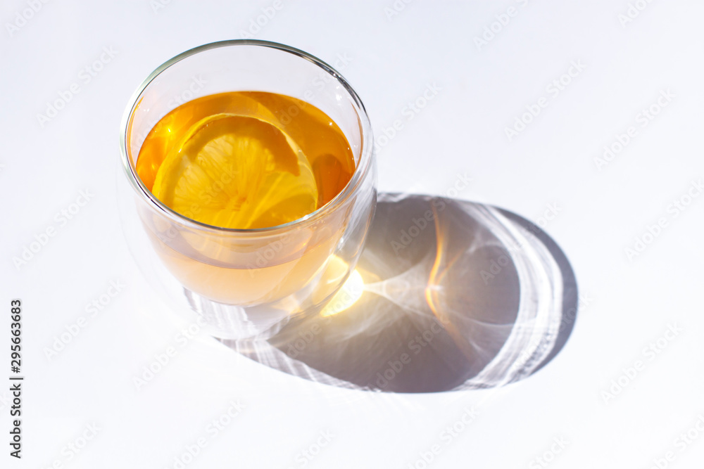 Glass of green tea with lemon and ginger close up Glass of green tea with lemon and ginger close up