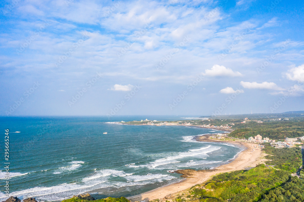Aerial view of sandy beach with tourists swimming in beautiful clear sea water Aerial view of sandy beach with tourists swimming in beautiful clear sea water