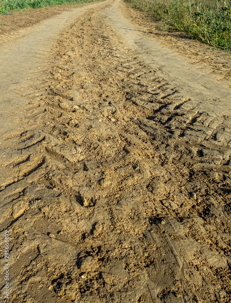 Tracks left by a tractor, on wet soil, ready for cultivation Tracks left by a tractor, on wet soil, ready for cultivation