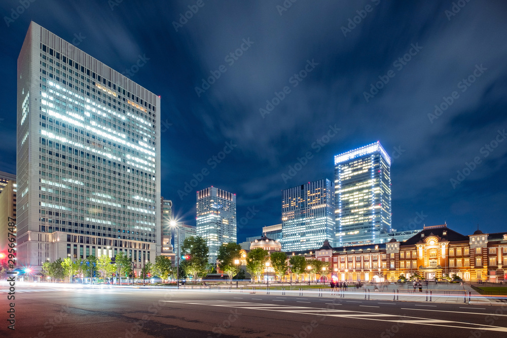 Tokyo city skyline at railway station surround by modern highrise building at twilight time.  Tokyo city, Japan.
