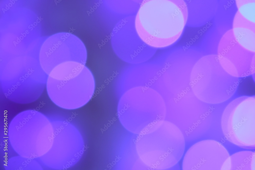 Many soft blue and purple blurry bokeh light on purple tone background in Christmas and New Year festival day, can use for background Many soft blue and purple blurry bokeh light on purple tone background in Christmas and New Year festival day, can use for background