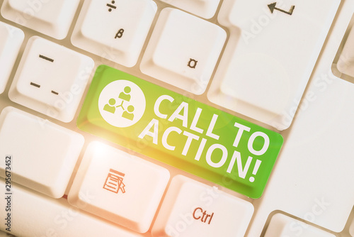 Writing note showing Call To Action. Business concept for exhortation do something in order achieve aim with problem White pc keyboard with note paper above the white background photo