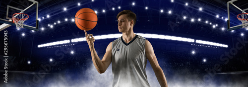 Basketball player spinning a ball on his finger photo