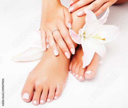 manicure pedicure with flower lily close up isolated on white perfect shape hands spa salon © iordani