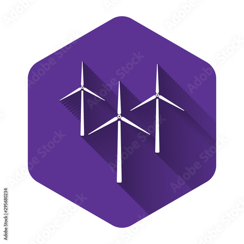 White Wind turbine icon isolated with long shadow. Wind generator sign. Windmill silhouette. Windmills for electric power production. Purple hexagon button. Vector Illustration © mingirov