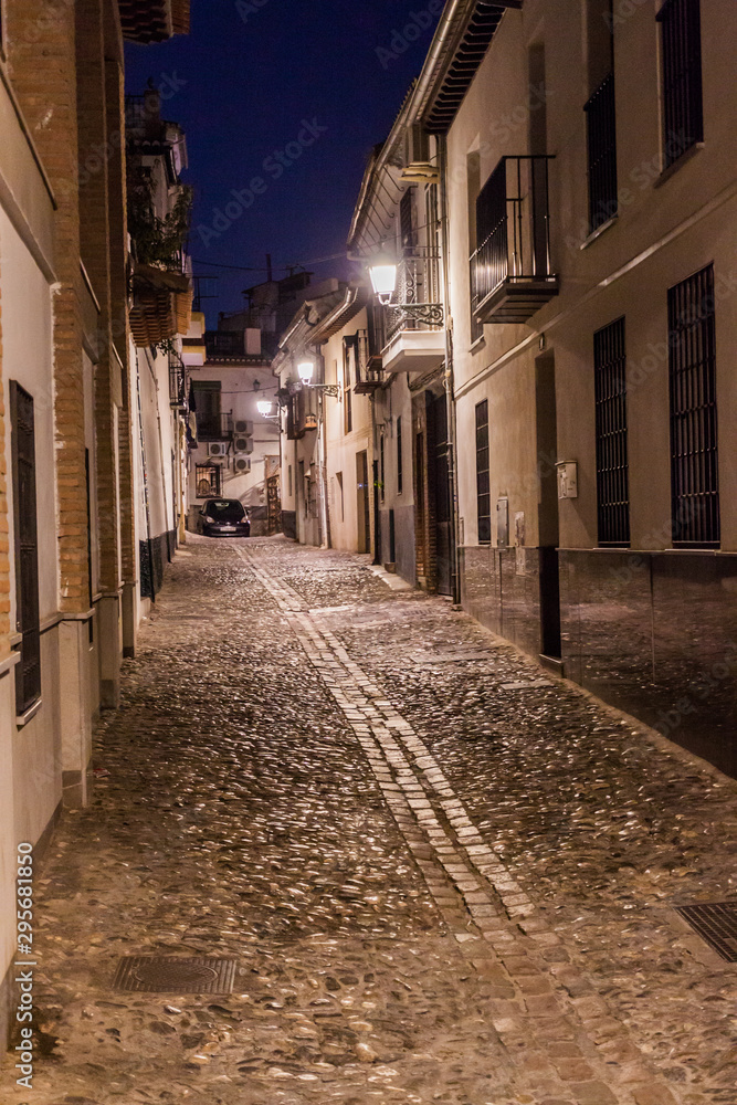 Evening in the narrow alley in the center of Granada, Spain Evening in the narrow alley in the center of Granada, Spain