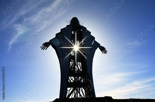 Statue The Heart of Jesus in the village of Lupeni - Romania 04.Nov.2018 The statue is made of stainless steel, it is 22 meters high and is situated on a hill near Lupeni town Harghita county photo