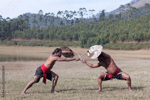 Kalaripayattu - Indian Marital art demonstration in Kerala, South India photo