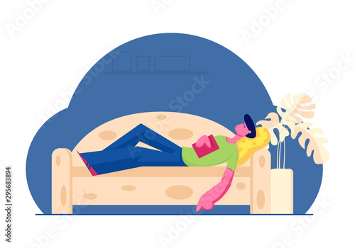 Young Man Sleeping on Sofa with Book in Hands at Home