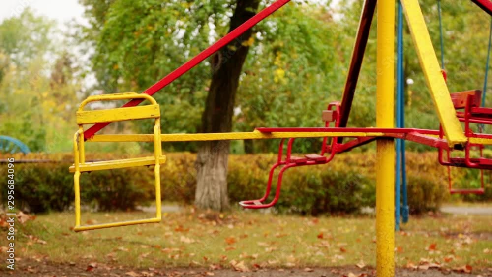 motion of an empty children's carousel. the carousel moves at an average speed counterclockwise. autumn. full hd, no sound. motion of an empty children's carousel. the carousel moves at an average speed counterclockwise. autumn. full hd, no sound.