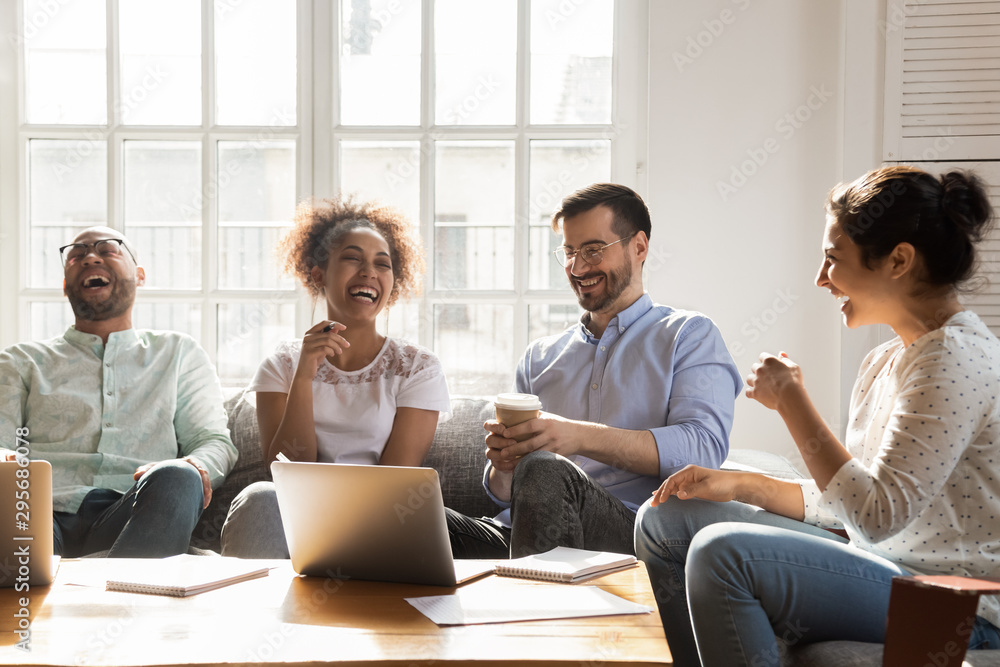 Happy diverse friends having fun, laughing at funny joke Happy diverse friends having fun, laughing at funny joke