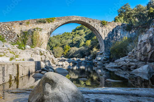 Stone bridge over the rocky gorge of the Alardos river. Madrigal de la Vera, Caceres, Extremadura, Spain. photo
