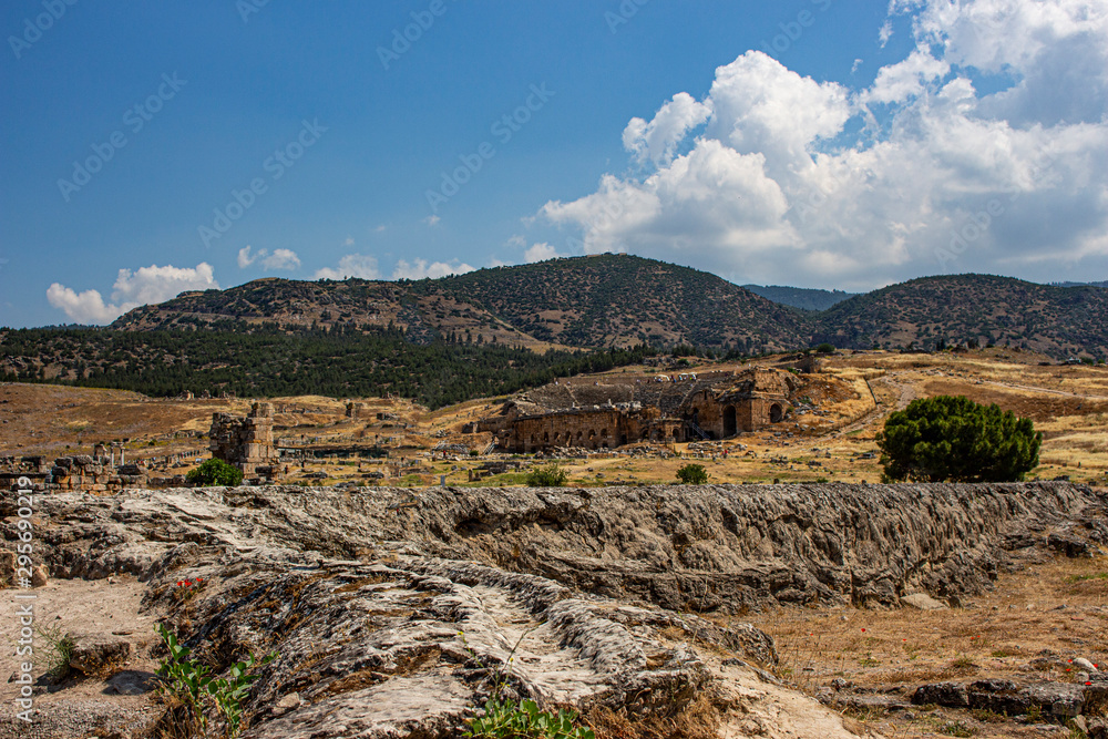 View of the rocky terrain with mountains in the background. View of the rocky terrain with mountains in the background.