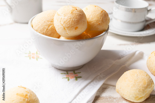 Brazilian snack cheese bread, Homemade cheese buns in arustic style, vintage white wooden background