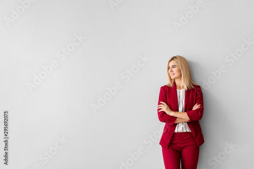 Beautiful stylish businesswoman on light background photo