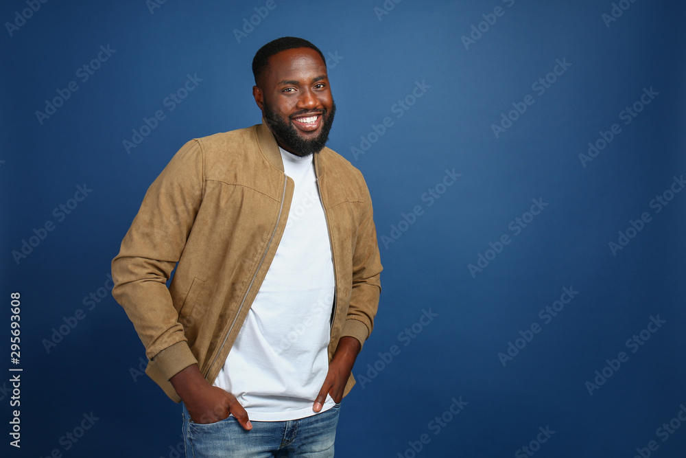 Happy African-American man on color background Happy African-American man on color background
