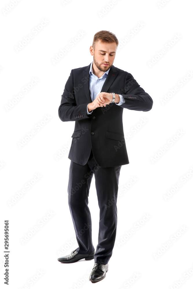 Portrait of handsome businessman looking at watch on white background Portrait of handsome businessman looking at watch on white background