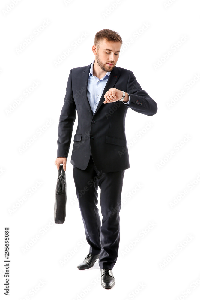 Portrait of handsome businessman looking at watch on white background Portrait of handsome businessman looking at watch on white background