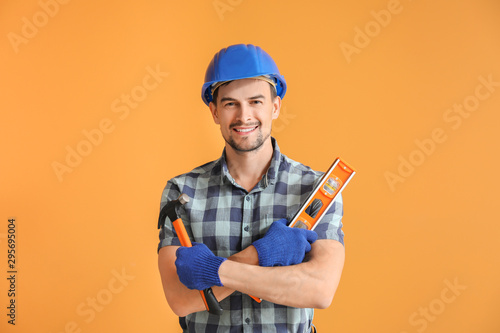 Portrait of male architect on color background photo