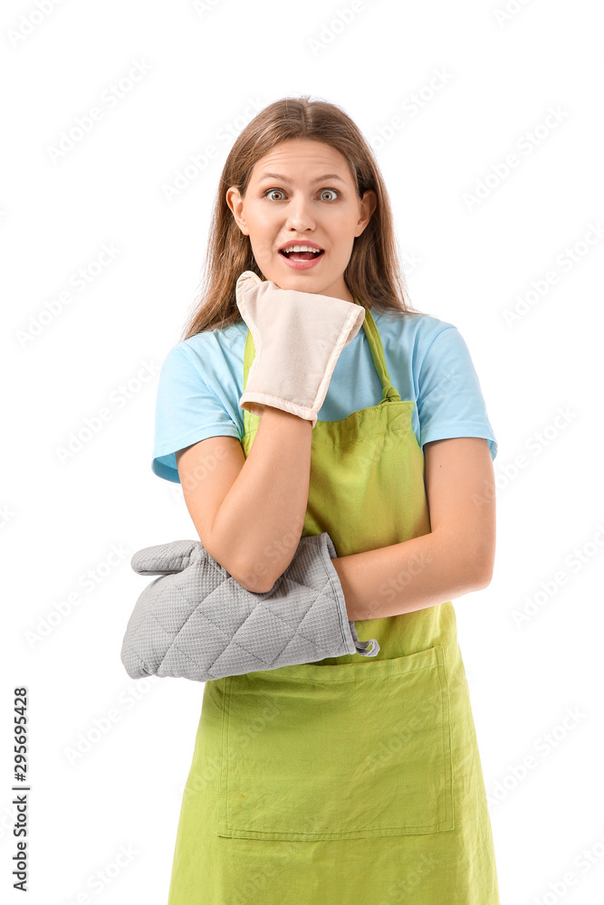 Surprised young woman in apron on white background Surprised young woman in apron on white background