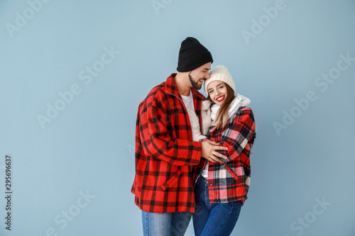 Happy young couple in warm ...