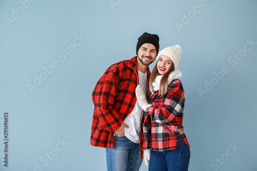 Happy young couple in warm ...