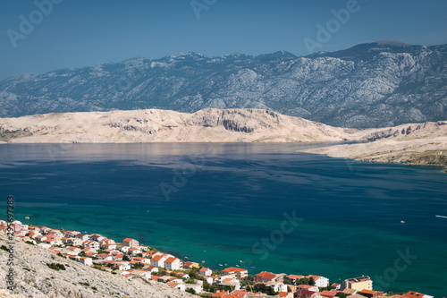 Laguna near Isle of Pag in Croatia with dalmatian mountain range in background