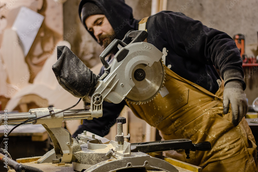 Carpenter using circular saw for wood Carpenter using circular saw for wood