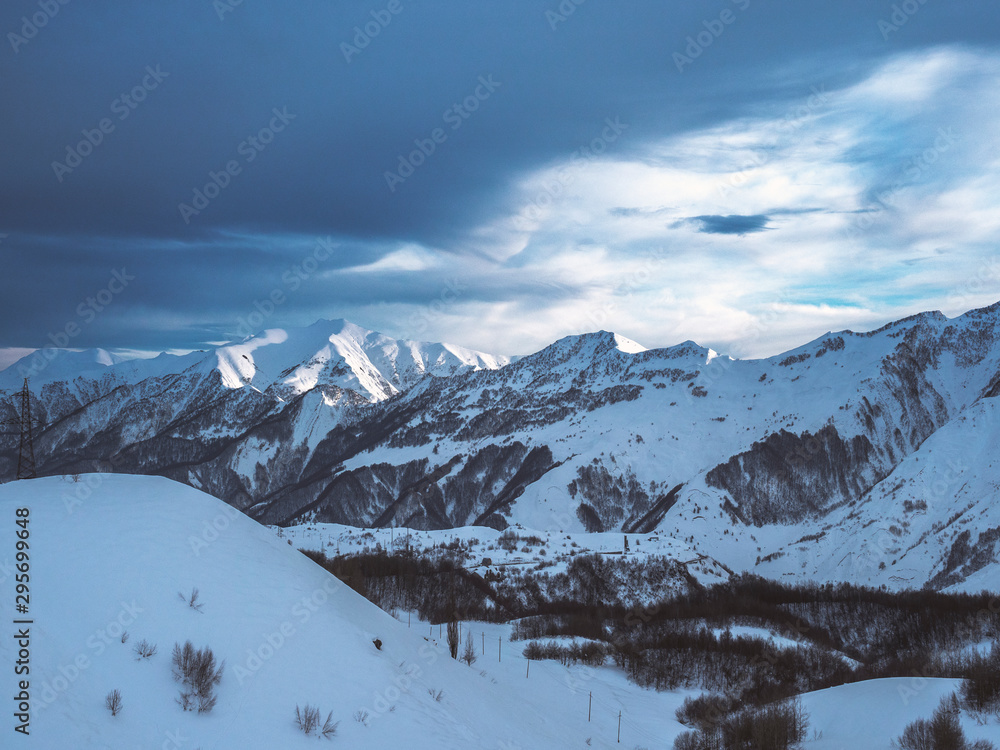 Snow-capped peaks of the Caucasus Mountains. Nature wallpaper.