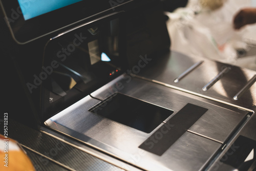 Self-checkout counter in a supermarket. Modern technology in trade. Electronic cashier.